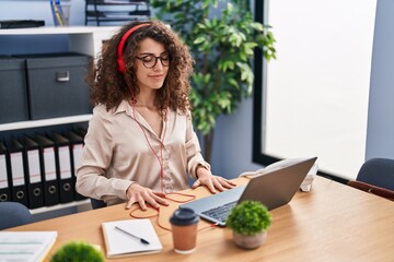 Sticker - Young hispanic woman business worker doing yoga exercise working at office