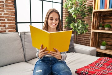 Canvas Print - Young blonde woman smiling confident reading book at home