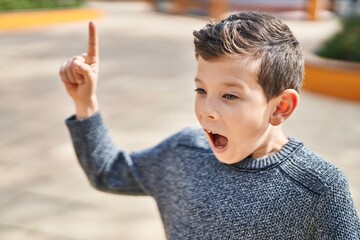 Poster - Blond child standing with idea expression at park