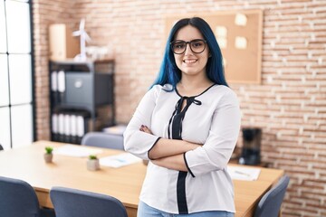 Wall Mural - Young caucasian woman business worker smiling confident standing with arms crossed gesture at office