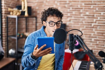 Poster - Young hispanic man artist singing song at music studio