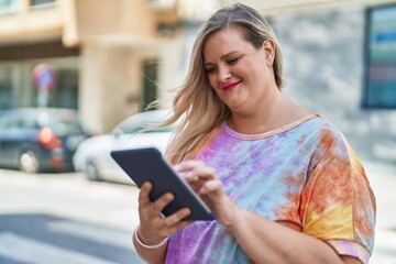 Sticker - Young woman smiling confident using touchpad at street