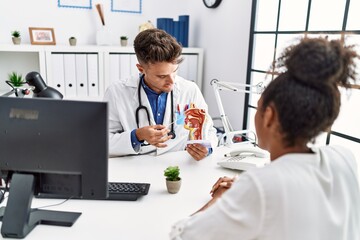 Sticker - Man and woman wearing doctor uniform having otolaryngology consultation at clinic