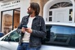 © Krakenimages.com - Middle age man using smartphone leaning on car at street