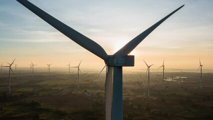 Sticker - 4K, Time Lapse of Wind electric generator in the rising sun. Wind generators stand in agricultural fields with Powerful wind turbine farms for pure energy production on the background.