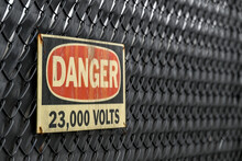 Danger 23,000 Volts Sign At Electric Substation