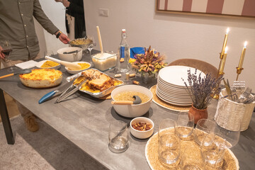 Decorated New Year's table with golden candles