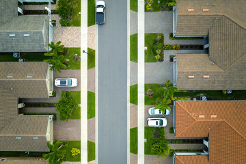 Sticker - View from above of densely built residential houses in closed living clubs in south Florida. American dream homes as example of real estate development in US suburbs