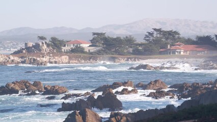 Wall Mural - Rocky craggy ocean beach, big sea waves crashing on shore, Monterey 17-mile drive, California coast, USA. Water splashing in beachfront waterfront Pacific Grove, seascape, seamless looped cinemagraph.