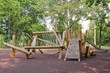 © Lidia - Wooden modern ecological safety children outdoor playground equipment in public park. Nature architecture construction playhouse in city. Children rest and childhood concept. Idea for games on air.