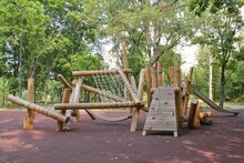 Wooden Modern Ecological Safety Children Outdoor Playground Equipment In Public Park. Nature Architecture Construction Playhouse In City. Children Rest And Childhood Concept. Idea For Games On Air.
