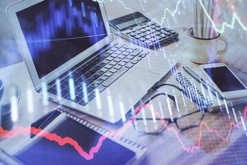 Poster - Stock market graph on background with desk and personal computer. Multi exposure. Concept of financial analysis.