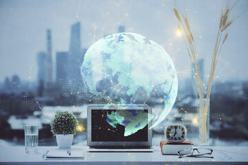 Poster - Computer on desktop with social network hologram. Double exposure. Concept of international people connections.