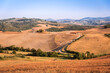 Tuscany hills and fields. Tuscany panorama, rolling hills and green fields at sunset