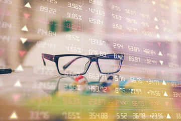 Poster - Financial chart hologram with glasses on the table background. Concept of business. Double exposure.