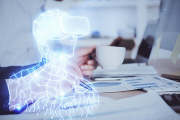 Poster - Abstract man wearing augmented reality headsets computer work with writing human background. AR concept. Double exposure.