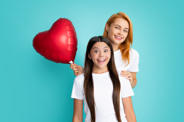 Sticker - Love mom. Mother and daughter hold heart balloon. Happy mother and daughter holding love heart balloon on blue background.