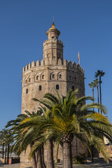 Wall Mural - Golden Tower (Torre del Oro, from 13th century) located on the left bank of Guadalquivir River - historic military observation tower and Spanish cultural heritage monument. Seville, Andalusia, Spain.