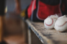 Close-up Of Baseball Balls On Table In Sports Dugout