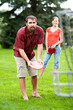 © Cavan Images - A man and woman play disk golf.