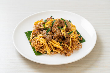 Wall Mural - stir-fried instant noodle with pork and egg