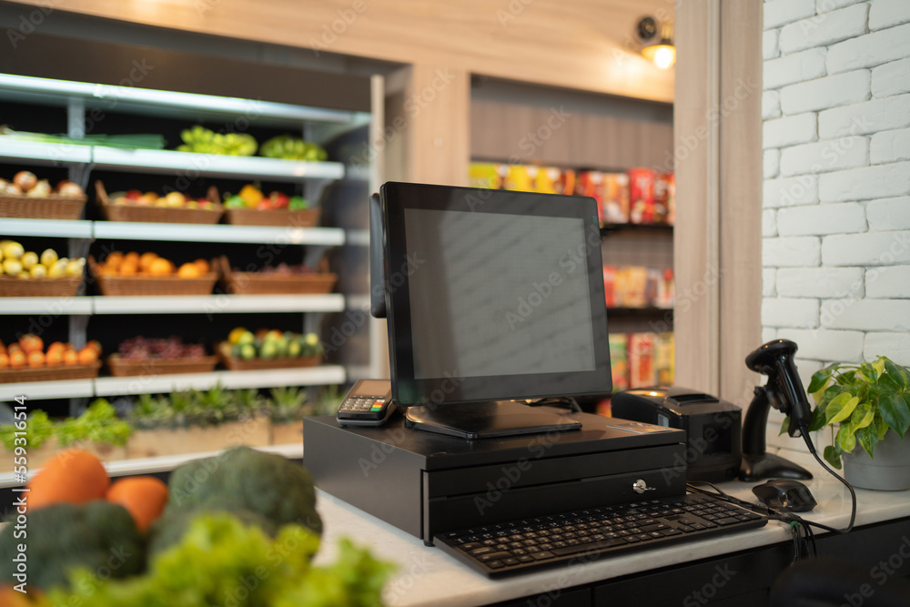 Blank empty screen of computer counter of supermarket or minimart retail shop and food on grocery products. Food shopping. People lifestyle. Business service.
