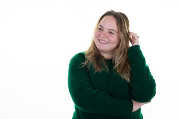 Wall Mural - Beautiful young girl keeping hand in hair and looking on camera chubby woman standing aside copyspace white background