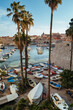 Boats anchored in Dubrovnik old town, in Croatia, on a tranquil sunny day