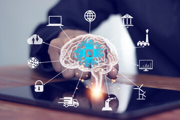 Wall Mural - Businessman using tablet to work brain of artificial intelligence (AI) in futuristic business and software development, coding on interface and synchronizing network connection, IoT, innovation