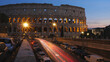 ROME, ITALY - OCTOBER 06, 2018: Sunset dusk street city lights fast motion timelapse at Colosseum in Rome