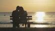 © MEDIAIMAG - Couple of lover sit on bench at beach, sunrise, beginning hope, dream
