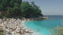 Idyllic Summer Travel Destination, Turquoise Water, White Beach And Green Pines