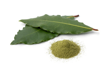 Wall Mural - Fresh bay leaves and a heap of bay leaf powder close up isolated on white background