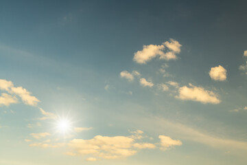 Canvas Print - white clouds and sun with sunlight on blue sky.