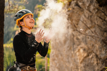 Wall Mural - Climber wearing in climbing equipment. Practicing rock-climbing on a rock  mountain wall. Climbing sports and bouldering concept. rock climber climbs on a rocky wall.