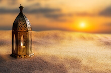 Oriental Lamp In Sand At Ramadan Night, Landscape With Bright Sunset Background For Invitation Card For Islamic Holiday Celebrations With Copy Space