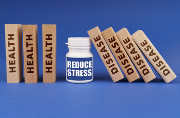 Medical concept. On a blue background, wooden dies, a white jar with the inscription - REDUCE STRESS