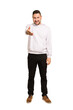 © Asier - Full body adult latin man cut out isolated stretching hand at camera in greeting gesture.