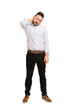 © Asier - Full body adult latin man cut out isolated having a neck pain due to stress, massaging and touching it with hand.