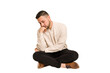 © Asier - Adult latin man sitting on the floor cut out isolated who feels sad and pensive, looking at copy space.