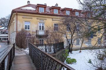 Wall Mural - View of Uzupis Neighborhood buildings and streets in winter surrounded by Vilnia River, Vilnius, Lithuania