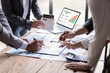 canvas print picture - Group of confident business people point to graphs and charts to analyze market data, balance sheet, account, net profit to plan new sales strategies to increase production capacity.	