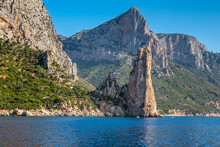 Sardinian Seashore In The Baunei Municipality With Pedra Longa Cliff, Italy