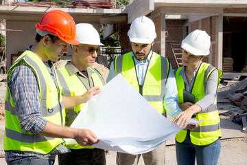 Team group of contractor and architect with foreman explaining about scheme building site for planning project to worker and looking blueprint, construction site, development and structure.