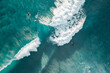 © FRPhotos - Surfers are seen from above in blue pristine ocean water