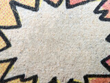 Fototapeta Miasta - Closeup view of an old comic book page with empty chat pow bubble on paper fiber texture background