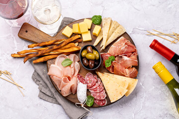 Wall Mural - Antipasto board with various meat and cheese snacks