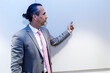 © Westend61 - Mature businessman pointing at whiteboard giving speech in conference room at office