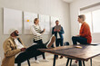© Jacob Lund - Happy business colleagues having a meeting in an office