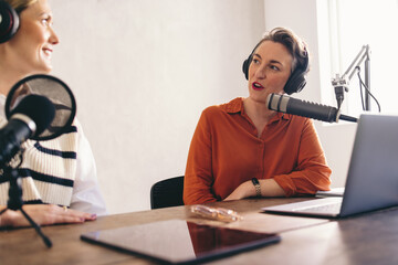 Wall Mural - Female radio hosts having a conversation in a home studio